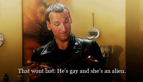 In Rose, What magazine is the Ninth doctor reading when he remarks "That won't last. He's gay and she's an alien!" ?